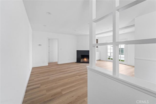 18656 Runnymede St, Reseda, CA 91335 - unfurnished living room with a fireplace with flush hearth and wood finished floors