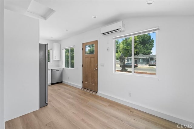 18656 Runnymede St, Reseda, CA 91335 - entrance foyer with a wall unit AC, light wood-type flooring, lofted ceiling, and recessed lighting