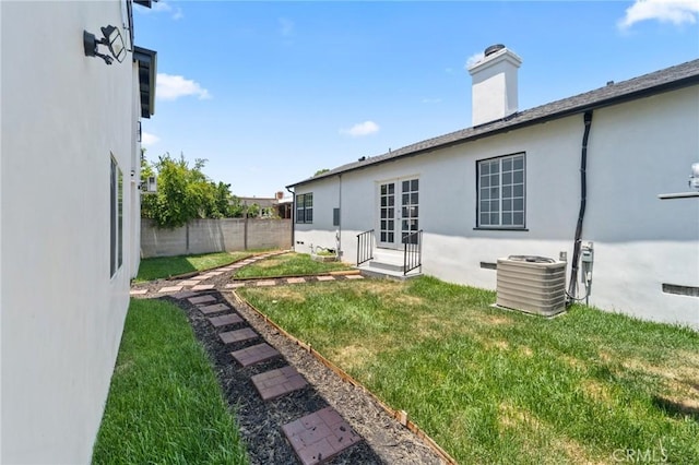 18656 Runnymede St, Reseda, CA 91335 - rear view of house featuring stucco siding, a chimney, and entry steps
