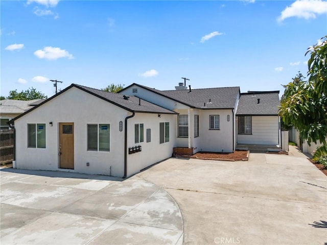 18656 Runnymede St, Reseda, CA 91335 - back of house with a patio area, a shingled roof, and stucco siding