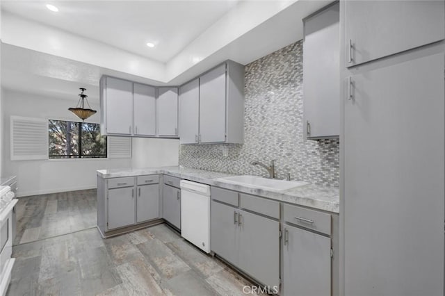 13331 Moorpark St Unit 206, Sherman Oaks, CA 91423 - kitchen with white dishwasher, gray cabinetry, light countertops, tasteful backsplash, and recessed lighting