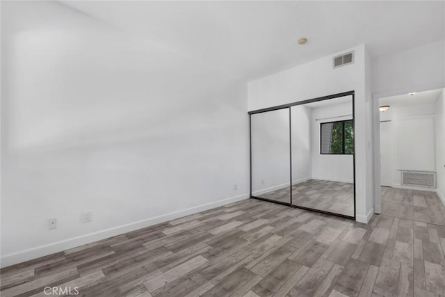 13331 Moorpark St Unit 206, Sherman Oaks, CA 91423 - unfurnished bedroom with wood finished floors and a closet