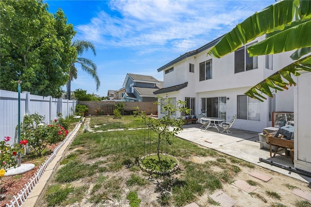 3681 Foxplain Rd, Corona, CA 92882 - fenced backyard featuring a patio area