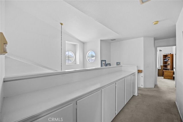 3681 Foxplain Rd, Corona, CA 92882 - corridor with light colored carpet and vaulted ceiling