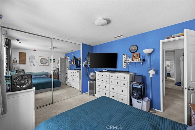3681 Foxplain Rd, Corona, CA 92882 - bedroom featuring a textured ceiling, carpet flooring, and a closet