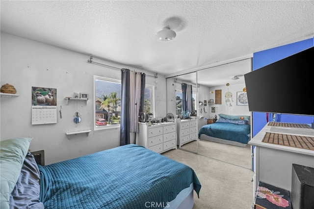 3681 Foxplain Rd, Corona, CA 92882 - bedroom featuring a textured ceiling, light carpet, multiple windows, and a closet