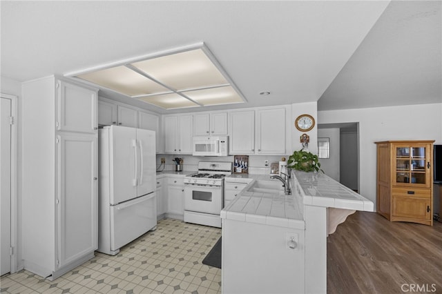3681 Foxplain Rd, Corona, CA 92882 - kitchen featuring white appliances, tile counters, a peninsula, and white cabinetry