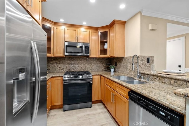 2421473 El Pilar, Laguna Niguel, CA 92677 - kitchen with stainless steel appliances, ornamental molding, light stone countertops, glass insert cabinets, and decorative backsplash