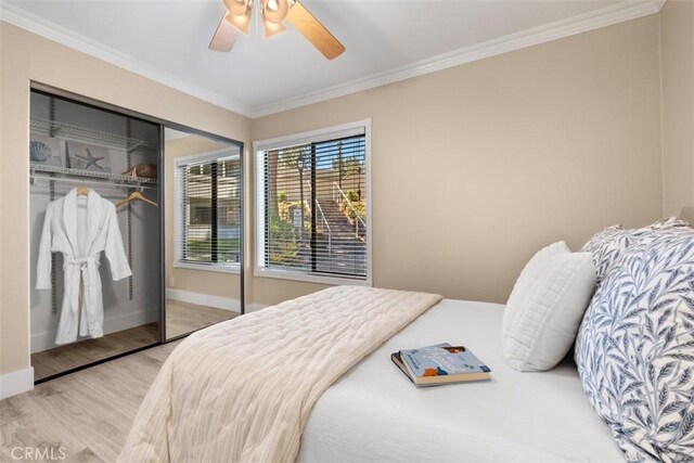 2421473 El Pilar, Laguna Niguel, CA 92677 - bedroom featuring wood finished floors, crown molding, a closet, and ceiling fan