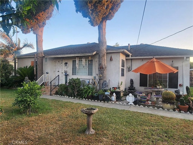 12138 Magnolia St, El Monte, CA 91732 - view of front of home with stucco siding and a front yard
