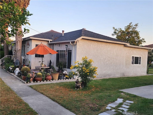 12138 Magnolia St, El Monte, CA 91732 - view of home's exterior with stucco siding, a yard, and a patio