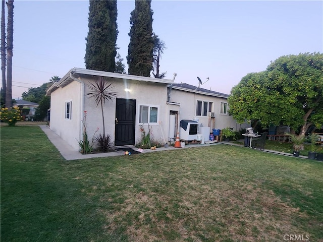 12138 Magnolia St, El Monte, CA 91732 - back of property featuring stucco siding and a yard