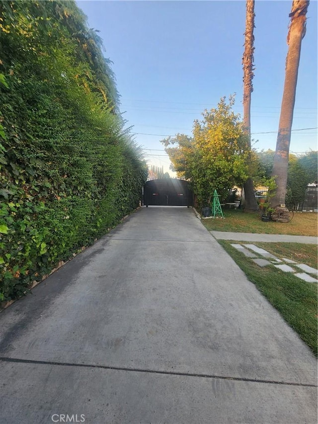 12138 Magnolia St, El Monte, CA 91732 - view of concrete surface with a gated entry