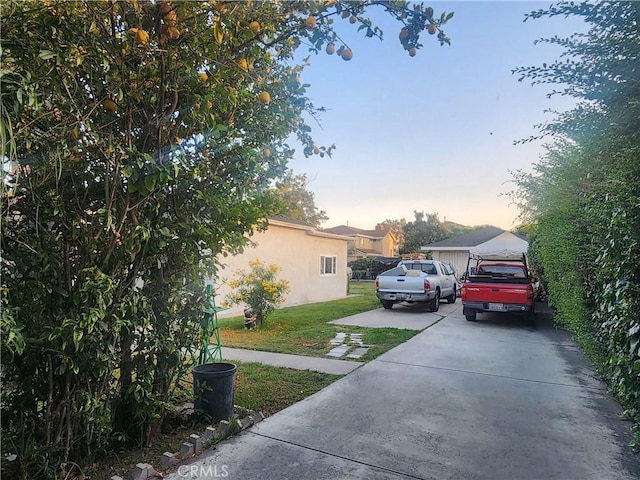 12138 Magnolia St, El Monte, CA 91732 - view of side of property with a lawn and stucco siding