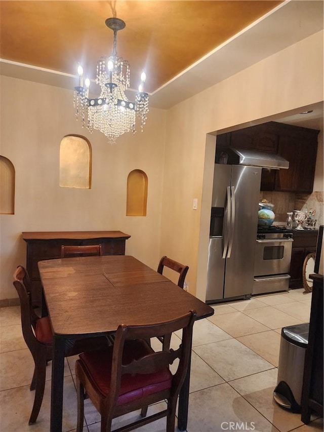 12138 Magnolia St, El Monte, CA 91732 - dining space with light tile patterned floors, a chandelier, and arched walkways