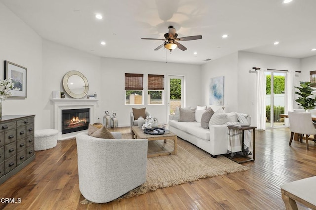 5000 Terramar Way, Oxnard, CA 93035 - living area with a ceiling fan, hardwood / wood-style flooring, a glass covered fireplace, and recessed lighting