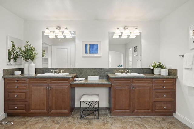 5000 Terramar Way, Oxnard, CA 93035 - full bathroom featuring a chandelier, double vanity, and stone finish flooring