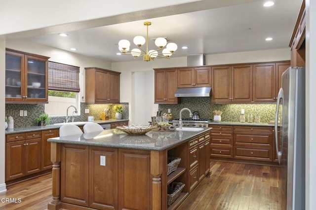 5000 Terramar Way, Oxnard, CA 93035 - kitchen featuring under cabinet range hood, freestanding refrigerator, dark wood-style floors, brown cabinetry, and recessed lighting