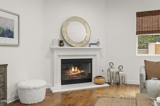 5000 Terramar Way, Oxnard, CA 93035 - sitting room featuring wood finished floors and a glass covered fireplace