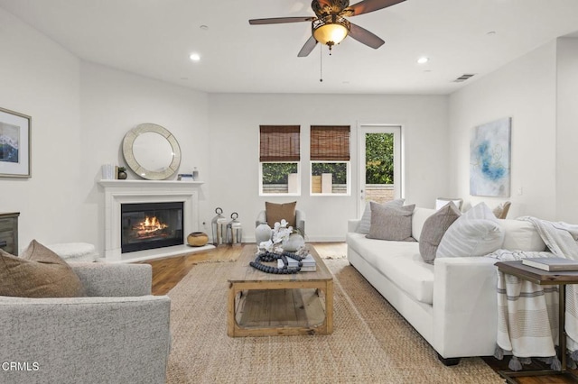 5000 Terramar Way, Oxnard, CA 93035 - living area featuring wood finished floors, ceiling fan, recessed lighting, and a glass covered fireplace