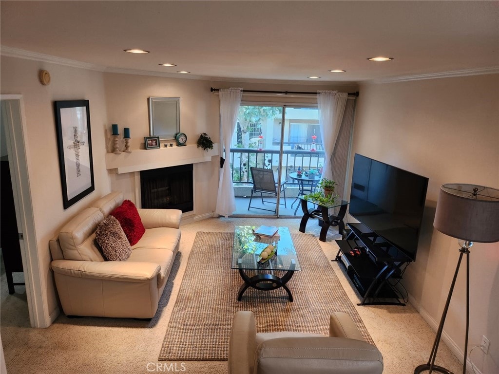 21450 Burbank Blvd Unit 211, Woodland Hills, CA 91367 - carpeted living room featuring recessed lighting, ornamental molding, and a fireplace