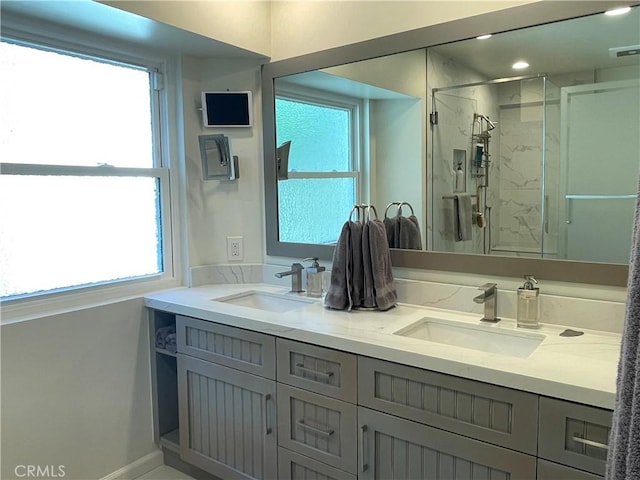 1158 S Westlake Blvd Unit D, Westlake Village, CA 91361 - bathroom featuring double vanity, a stall shower, and healthy amount of natural light
