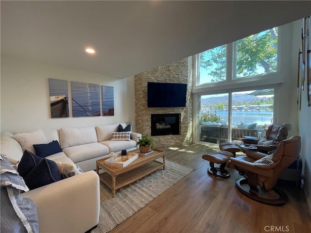 1158 S Westlake Blvd Unit D, Westlake Village, CA 91361 - living area featuring wood finished floors, a fireplace, a high ceiling, and recessed lighting