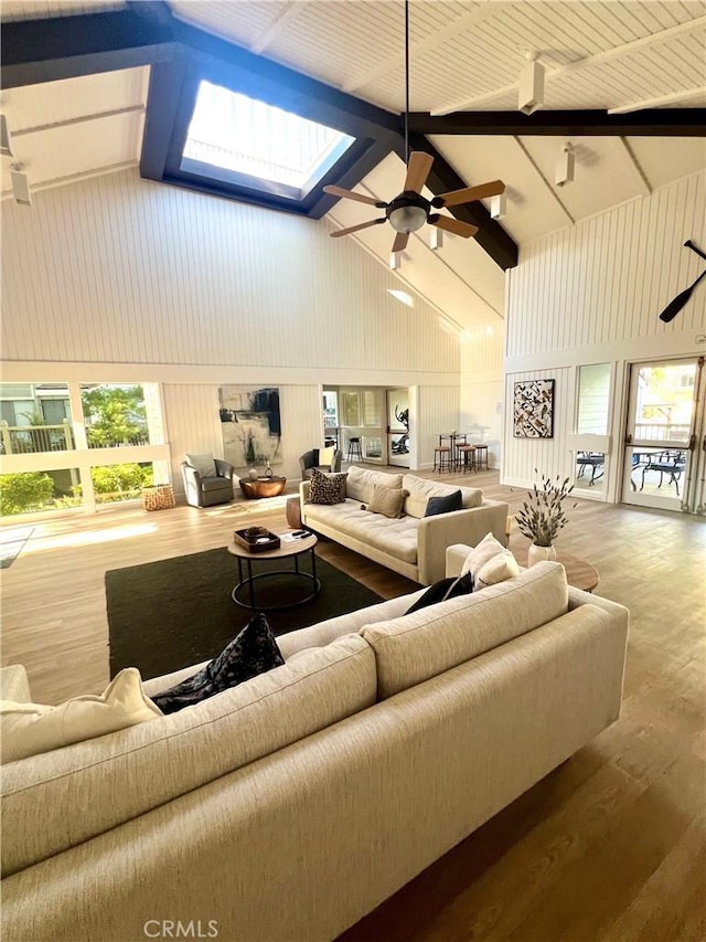 1158 S Westlake Blvd Unit D, Westlake Village, CA 91361 - living area featuring high vaulted ceiling, a ceiling fan, wood finished floors, healthy amount of natural light, and beam ceiling
