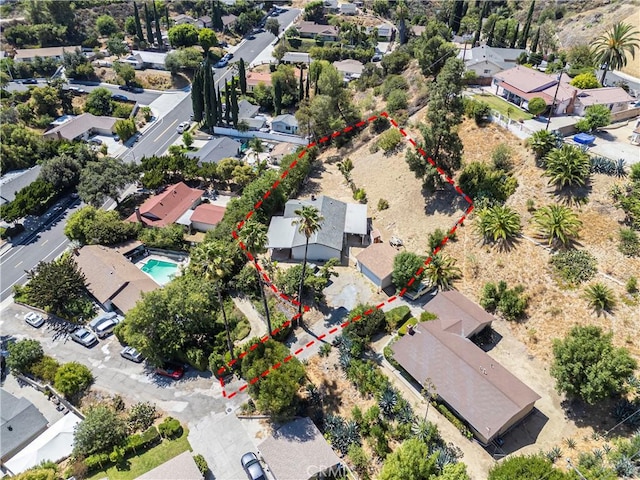 138 Banbridge Ave, La Puente, CA 91744 - aerial perspective of suburban area featuring property parcel outlined and a pool area