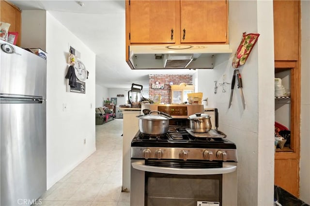 138 Banbridge Ave, La Puente, CA 91744 - kitchen with appliances with stainless steel finishes, exhaust hood, and light tile patterned floors