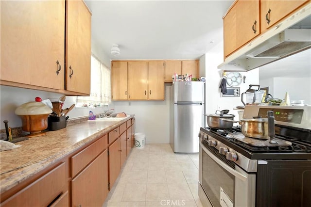 138 Banbridge Ave, La Puente, CA 91744 - kitchen featuring appliances with stainless steel finishes, under cabinet range hood, and light tile patterned flooring