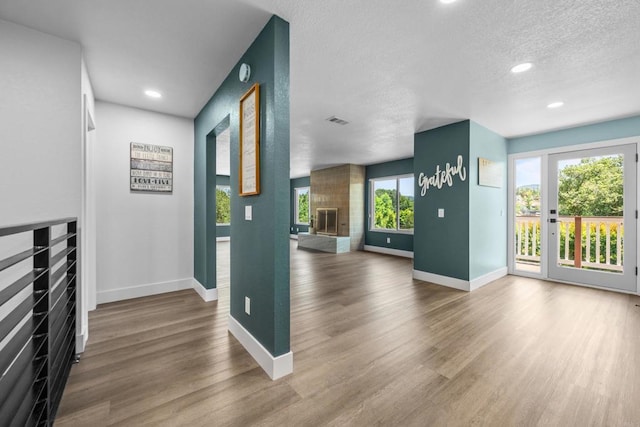 1026 Eucalyptus Ave, Vista, CA 92084 - hallway featuring wood finished floors, a textured ceiling, and recessed lighting