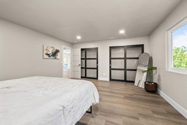 1026 Eucalyptus Ave, Vista, CA 92084 - bedroom featuring wood finished floors and recessed lighting
