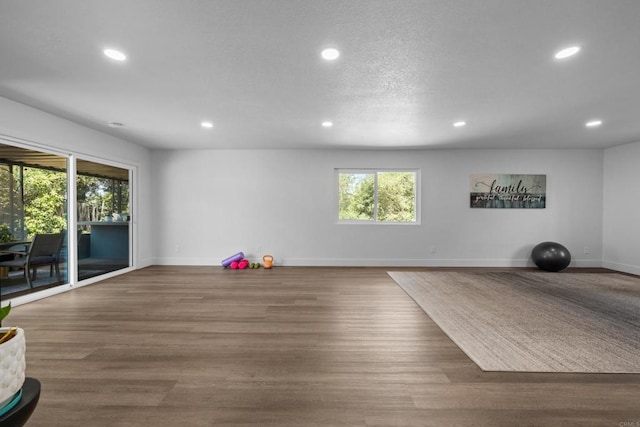 1026 Eucalyptus Ave, Vista, CA 92084 - workout room featuring recessed lighting, healthy amount of natural light, and wood finished floors