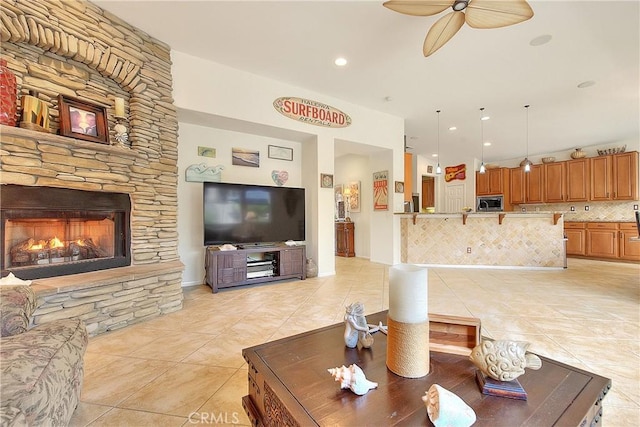 6236 Ashton Pl, Rancho Cucamonga, CA 91739 - living room with light tile patterned floors, ceiling fan, a fireplace, and recessed lighting