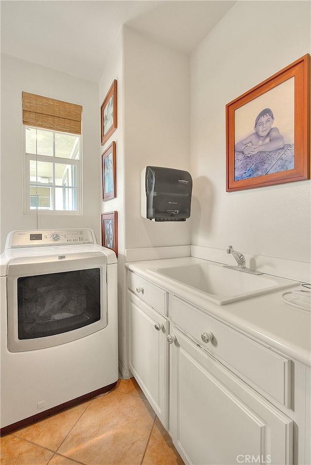 6236 Ashton Pl, Rancho Cucamonga, CA 91739 - laundry area with washer / clothes dryer, cabinet space, and light tile patterned flooring