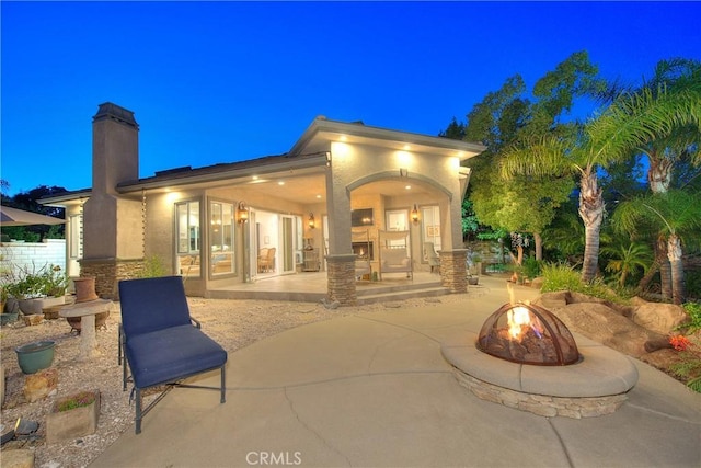 6236 Ashton Pl, Rancho Cucamonga, CA 91739 - patio at twilight with a patio and a fire pit