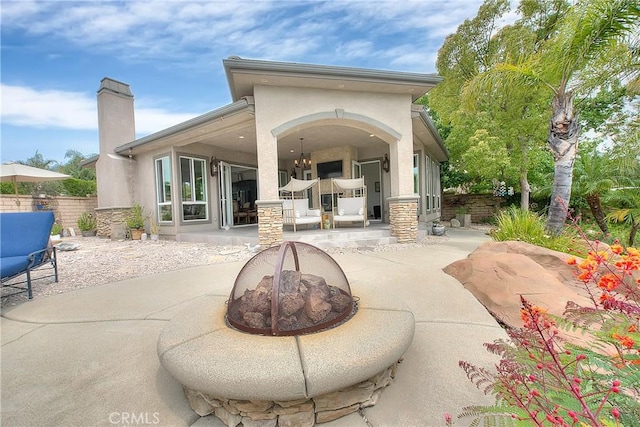 6236 Ashton Pl, Rancho Cucamonga, CA 91739 - view of patio / terrace featuring a fire pit