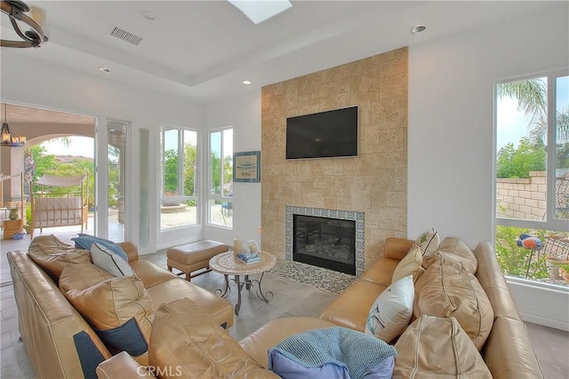 6236 Ashton Pl, Rancho Cucamonga, CA 91739 - tiled living area with plenty of natural light, a tiled fireplace, and recessed lighting