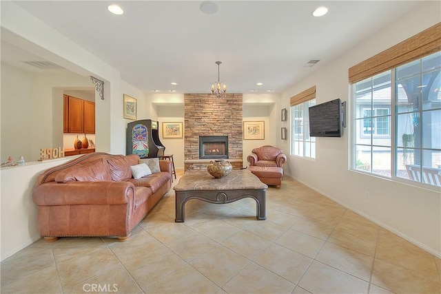 6236 Ashton Pl, Rancho Cucamonga, CA 91739 - living area featuring light tile patterned floors, a chandelier, recessed lighting, and a fireplace