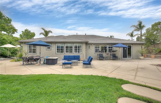 6236 Ashton Pl, Rancho Cucamonga, CA 91739 - rear view of house featuring a patio, stucco siding, outdoor lounge area, and a yard