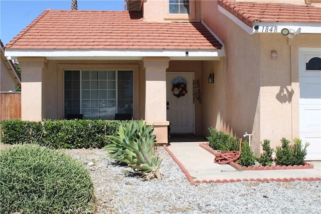 1848 Cascadian Way, San Jacinto, CA 92583 - view of exterior entry with stucco siding and a tiled roof