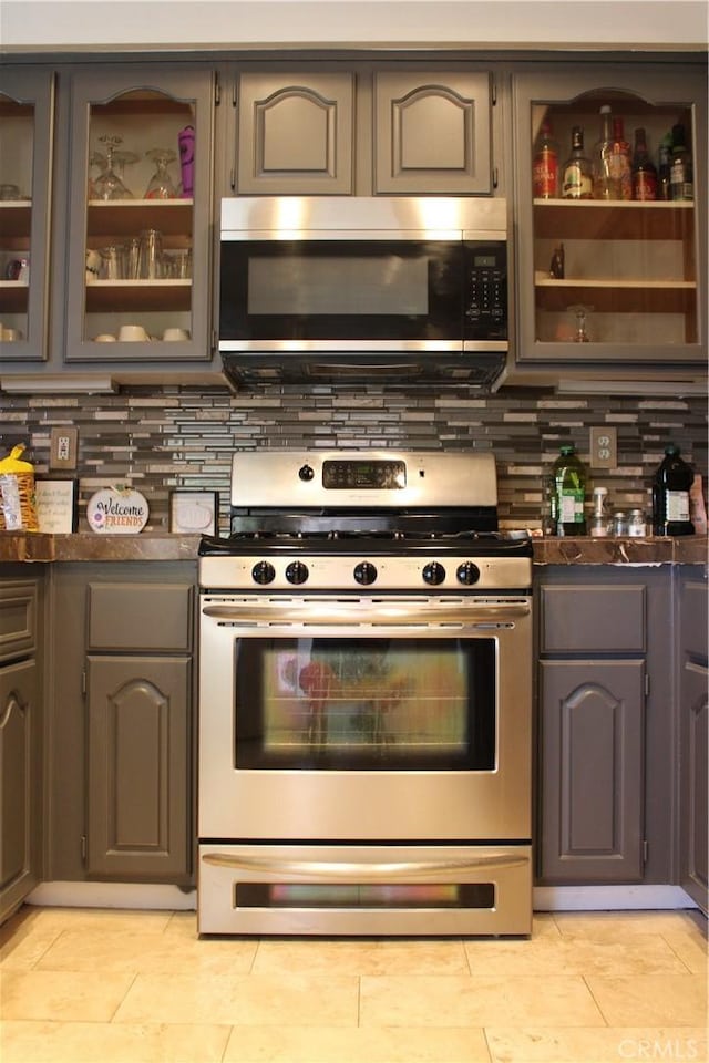 1848 Cascadian Way, San Jacinto, CA 92583 - kitchen with appliances with stainless steel finishes, dark countertops, gray cabinetry, and backsplash