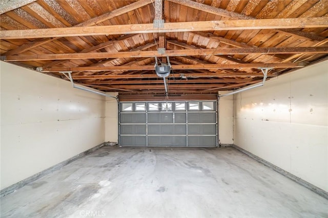 11220 Puente Way, Jurupa Valley, CA 91752 - garage featuring a garage door opener and baseboards