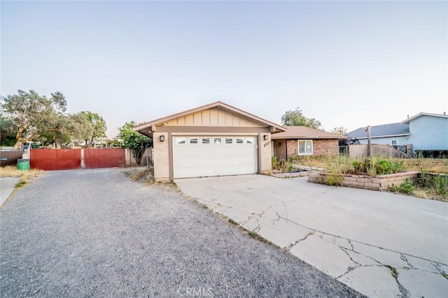 11220 Puente Way, Jurupa Valley, CA 91752 - ranch-style house with an attached garage and driveway