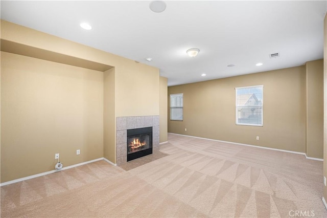 37351 Paintbrush Dr, Palmdale, CA 93551 - unfurnished living room with light carpet, a tiled fireplace, and recessed lighting