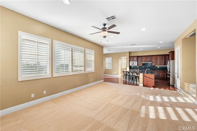 37351 Paintbrush Dr, Palmdale, CA 93551 - kitchen featuring open floor plan, recessed lighting, a ceiling fan, carpet flooring, and appliances with stainless steel finishes
