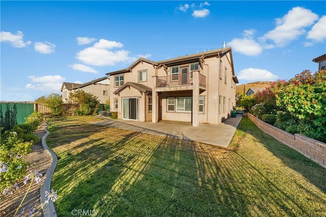 37351 Paintbrush Dr, Palmdale, CA 93551 - back of property with a balcony, a patio, stucco siding, and a fenced backyard
