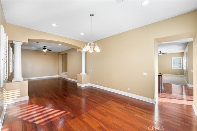 37351 Paintbrush Dr, Palmdale, CA 93551 - unfurnished living room with ornate columns, ceiling fan, wood finished floors, recessed lighting, and arched walkways