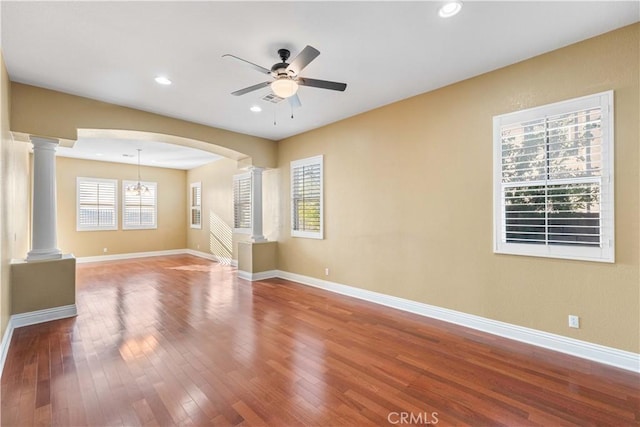 37351 Paintbrush Dr, Palmdale, CA 93551 - spare room featuring ornate columns, ceiling fan, wood finished floors, arched walkways, and recessed lighting